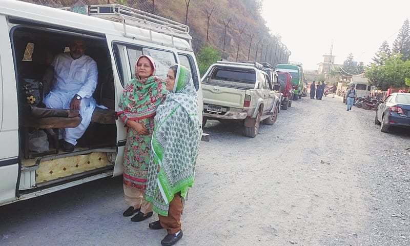 Outside the TATA office in Muzaffarabad, the Baig family prepares to leave for the Chakothi terminal on Monday.&mdash;Photo by writer