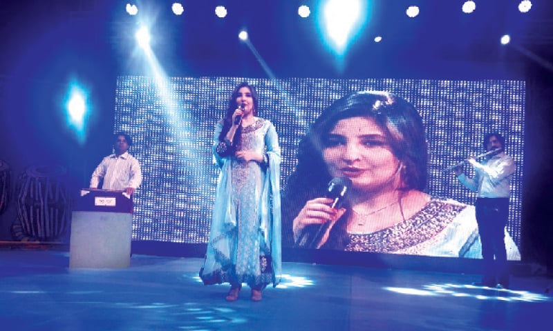 Popular Pashto singer Gulpanra performs at a musical concert at Nishtar Hall, Peshawar, on Tuesday. &mdash; Dawn