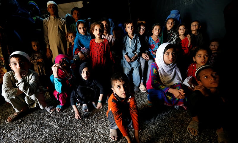 Afghan refugee children, returning from Pakistan, watch a short video clip about mines during a mines and explosives awareness program at a United Nations High Commissioner for Refugees (UNHCR) registration centre in Kabul, Afghanistan Sept 27.— Reuters