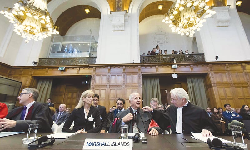 THE HAGUE: The delegation of the Republic of the Marshall Islands waiting for announcement of the judgement at the International Court of Justice on Wednesday.—AFP THE HAGUE: The delegation of the Republic of the Marshall Islands waiting for announcement of the judgement at the International Court of Justice on Wednesday.—AFP