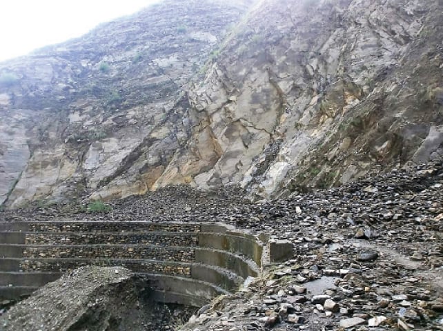 Reconstruction of rain-hit Barang-Khar road is yet to start. &mdash; Dawn