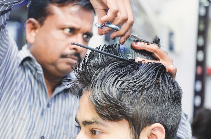 For Karachiites, a hairstyle must reflect their personality: a customer gets the ‘Ronaldo’ hairstyle