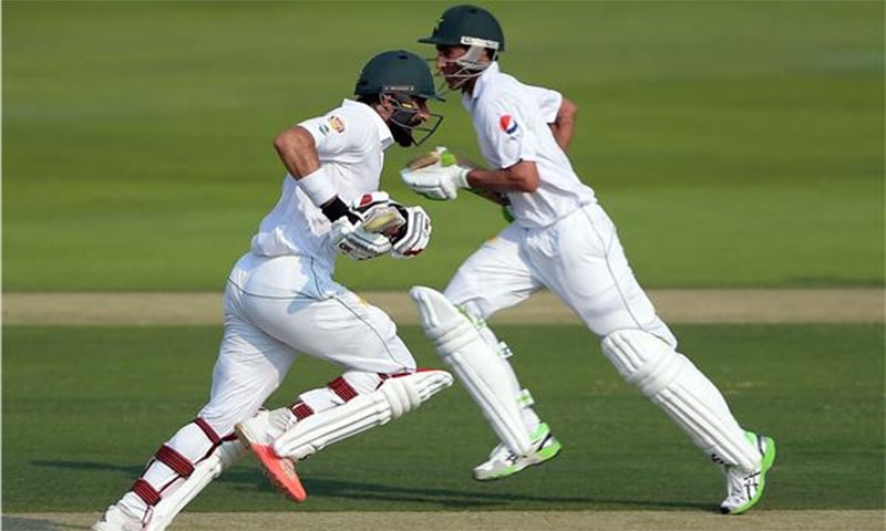 Misbah-ul-Haq and Younis Khan run between the wickets. ─AFP
