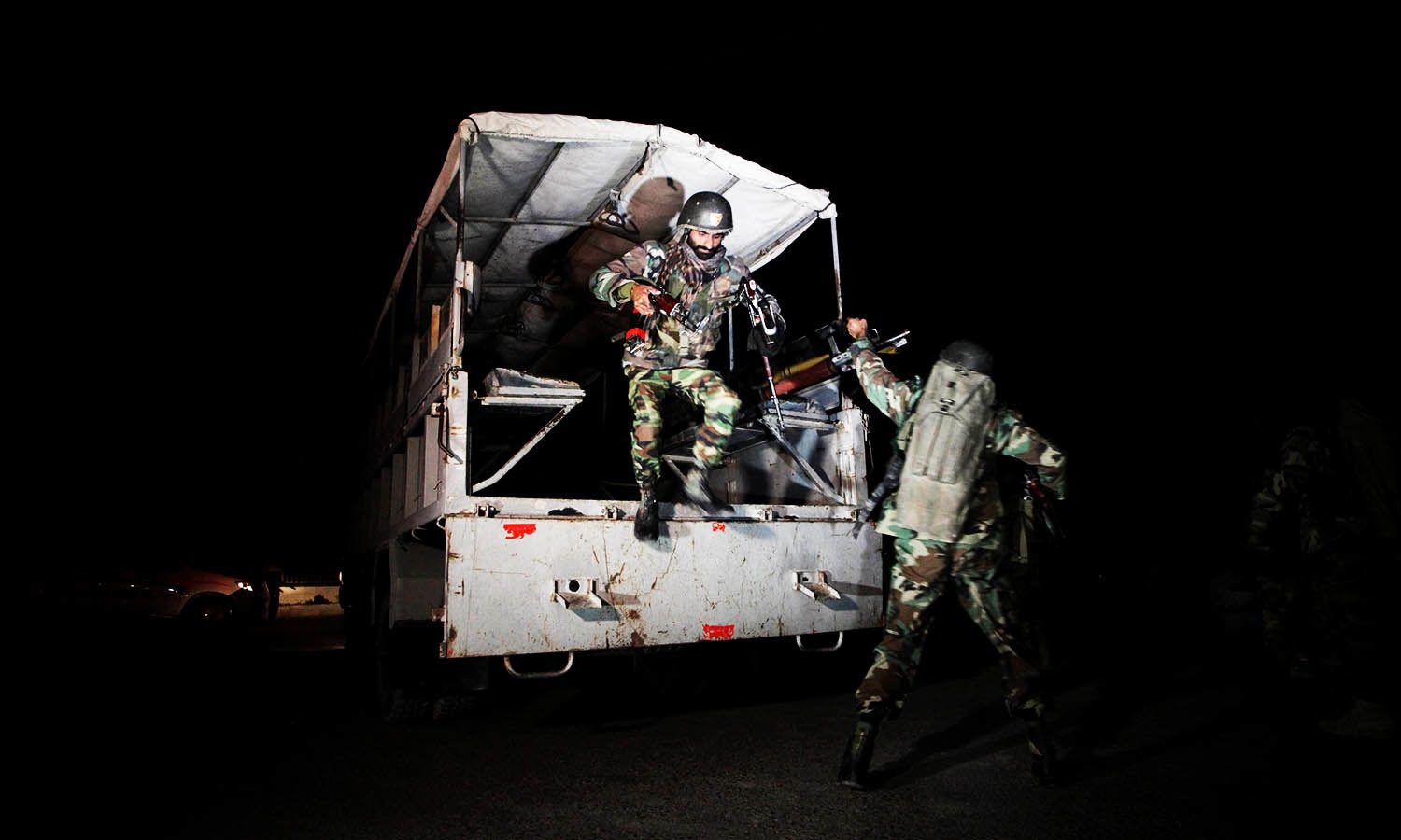 Troops rush to the Police Training Centre after an attack on the academy in Quetta. — Reuters