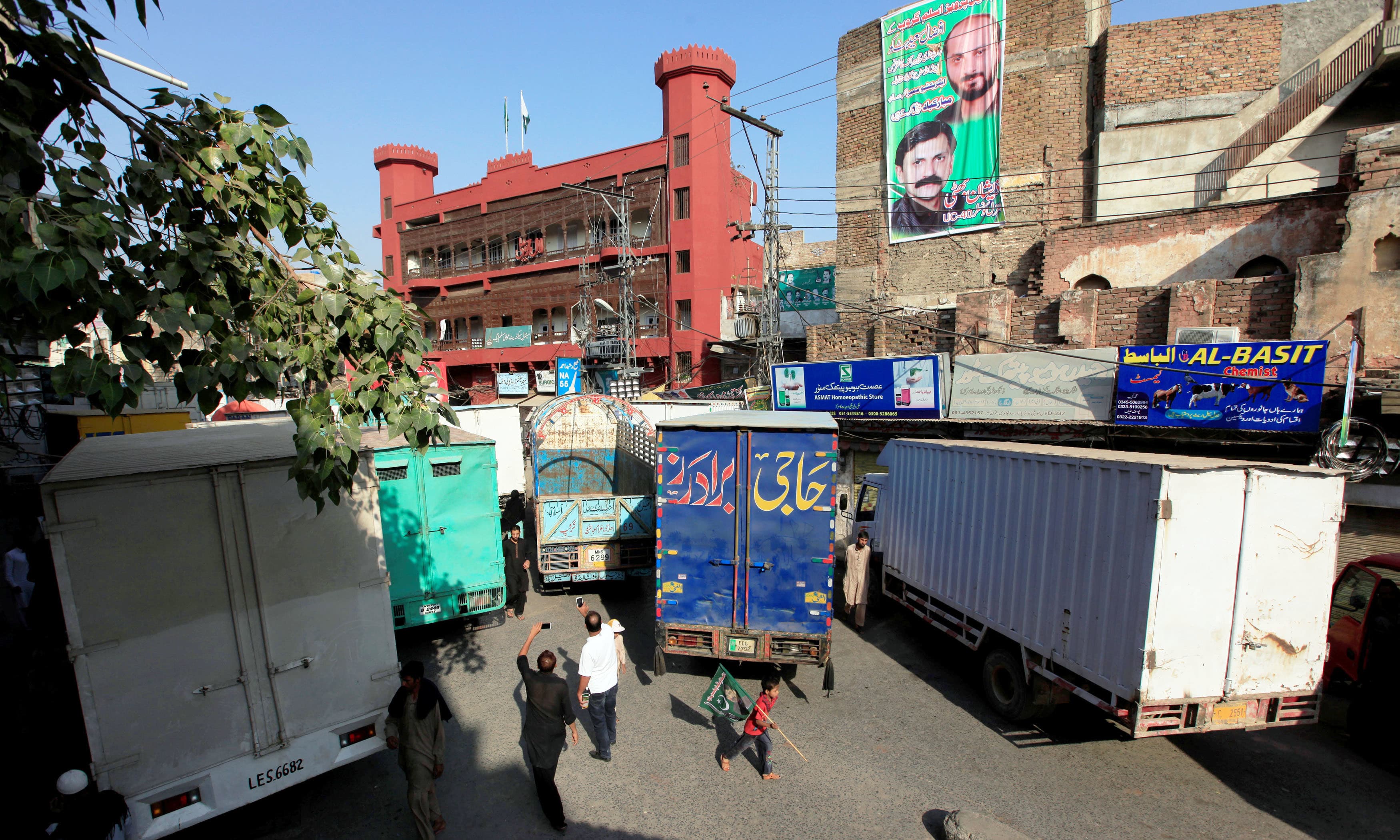 Trucks block Lal Haveli, the venue of protest organised by Awami Muslim League. —Reuters