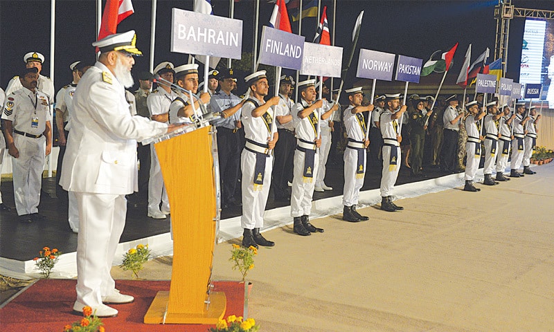 KARACHI: Commander Pakistan Fleet Vice Admiral Syed Arifullah Hussaini (L) inaugurates the 49th CISM Sailing Championship alongside the competing teams at the DHA Marina Club on Friday.—Anis Hamdani/White Star KARACHI: Commander Pakistan Fleet Vice Admiral Syed Arifullah Hussaini (L) inaugurates the 49th CISM Sailing Championship alongside the competing teams at the DHA Marina Club on Friday.—Anis Hamdani/White Star
