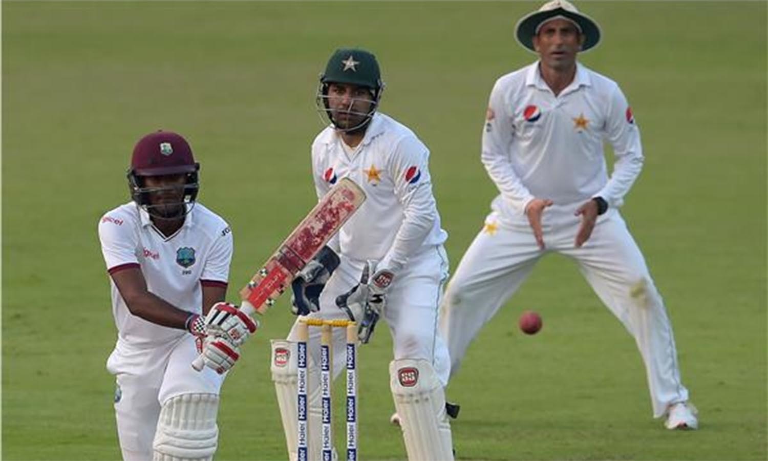 Kraigg Brathwaite plays a shot as wicketkeeper Sarfraz Ahmed and Younis Khan look on during the second day of the third Test. ─AFP Kraigg Brathwaite plays a shot as wicketkeeper Sarfraz Ahmed and Younis Khan look on during the second day of the third Test. ─AFP