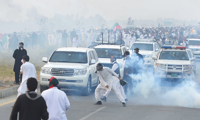 Police fired tear gas on Pakistan Tehreek-i-Insaf supporters in Swabi who tried to remove barricades while marching towards Islamabad on Monday.&mdash;AFP