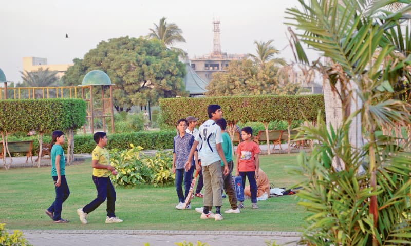 Children assembling themselves before a game of tape-ball cricket at Aziz Bhatti Park in Gulshan.