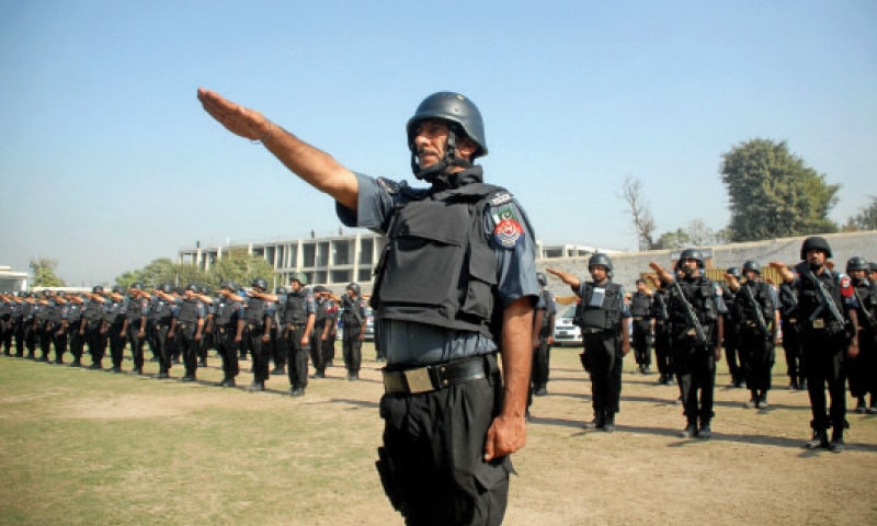 Personnel of the City Patrol Force take oath at a ceremony held at Malik Saad Shaheed Police Lines, Peshawar, on Thursday. &mdash; Photo by Shahbaz Butt
