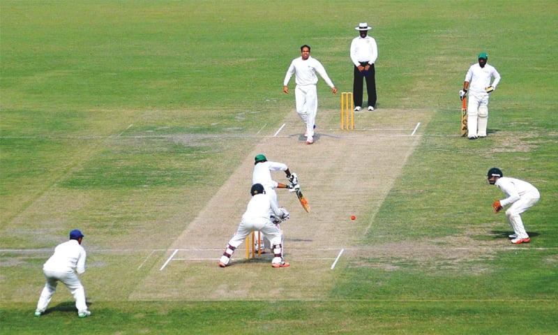 MULTAN: HBL batsman Rameez Aziz plays a defensive stroke against Wapda spinner Zulfiqar Babar during their Quaid-i-Azam Trophy National Championship match at the Multan Cricket Stadium on Tuesday.—APP MULTAN: HBL batsman Rameez Aziz plays a defensive stroke against Wapda spinner Zulfiqar Babar during their Quaid-i-Azam Trophy National Championship match at the Multan Cricket Stadium on Tuesday.—APP