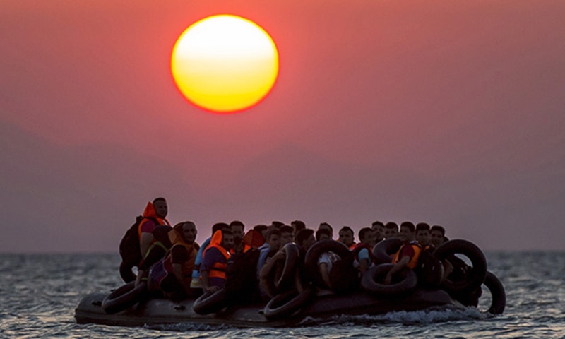 Migrants on a dinghy approach the southeastern island of Kos, Greece. ─AP Migrants on a dinghy approach the southeastern island of Kos, Greece. ─AP