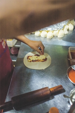 Anti-clockwise (top) Putting in the filling; (Below) Preparing the  naan; frying is done carefully; cutting into portions; ready to serve