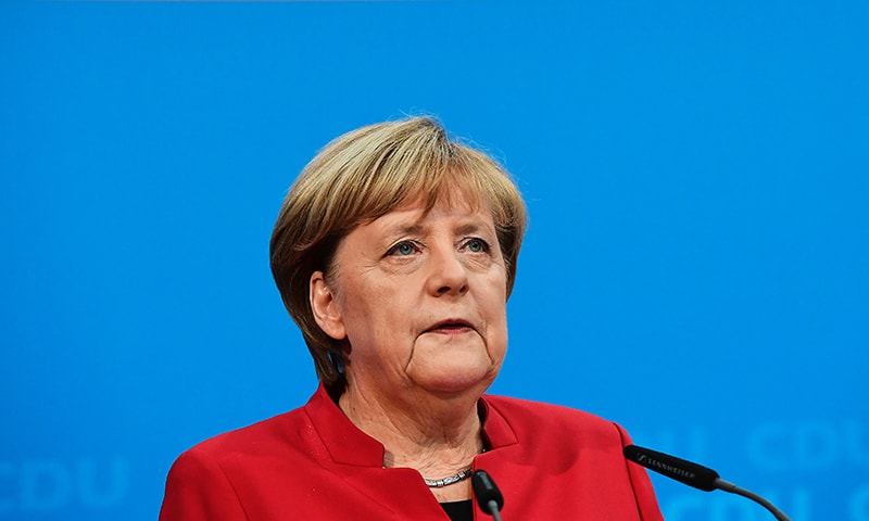 German chancellor Angela Merkel addresses a press conference at the  Christian Democratic Union (CDU) party headquarters. -AFP