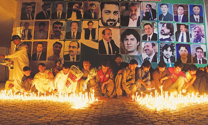 Residents light candles for lawyers killed in the blast at the Civil Hospital in Quetta. &mdash;Reuters