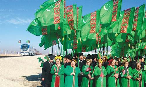 People attend the opening ceremony of a railway link to Afghanistan at the Imamnazar customs ontrol point in Turkmenistan on Monday.&mdash;Reuters