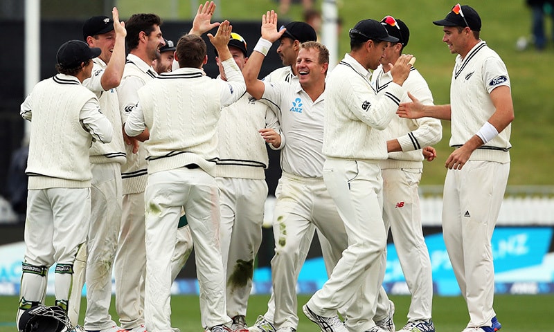 New Zealand players celebrate their win over Pakistan during day five of the second Test at Seddon Park in Hamilton on Nov 29.&mdash; AFP