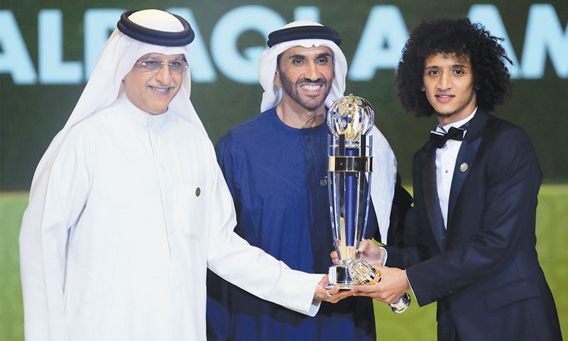 ABU DHABI: Asian Football Confederation president Sheikh Salman bin Ebrahim Al Khalifa (L) and Abu Dhabi Sports Council chairman Sheikh Nahyan Bin Zayed Al Nahyan (C) present the AFC Player of the Year trophy to Omar Abdulrahman.—AFP ABU DHABI: Asian Football Confederation president Sheikh Salman bin Ebrahim Al Khalifa (L) and Abu Dhabi Sports Council chairman Sheikh Nahyan Bin Zayed Al Nahyan (C) present the AFC Player of the Year trophy to Omar Abdulrahman.—AFP