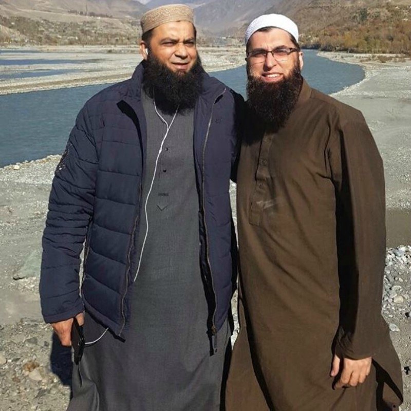 One of Junaid Jamshed's final photographs taken with friends posing against the snowcapped Tirchmir in Chitral