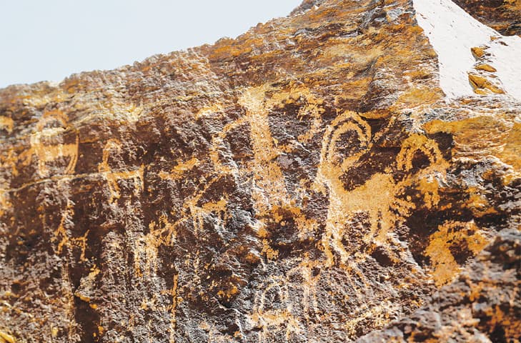 Ancient engravings of ibex deer are seen in the hills outside the town of Khomein in Iran.&mdash;AFP