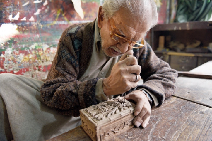 Hamid Ali, 65, makes a traditional Kashmiri jewellery box made of walnut wood. Typical carvings include chinnar leaves and lotus flowers, and the work is only carried out in bright daylight.