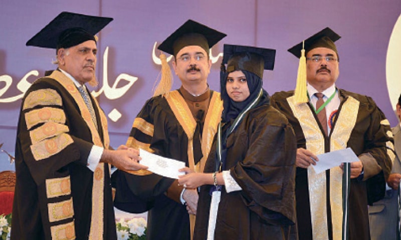 FAISALABAD: Governor Rafique Rajwana gives away a degree to a student at the convocation of the GC University Faisalabad. &mdash; Online