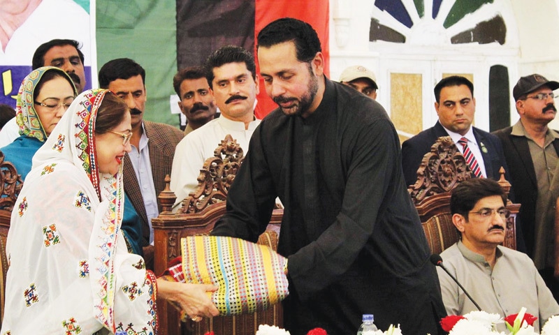 MOHAMMAD Ali Shah Jamote presents traditional gifts to MNA Faryal Talpur at a ceremony held at his residence in the Shah Alam Ji Wasi area of Matiari district on Wednesday.—Online