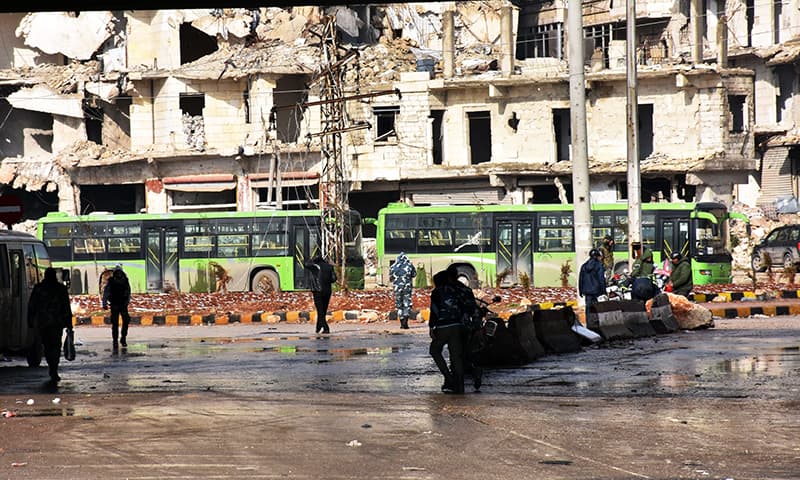 Militants are evacuated from Aleppo. -AFP