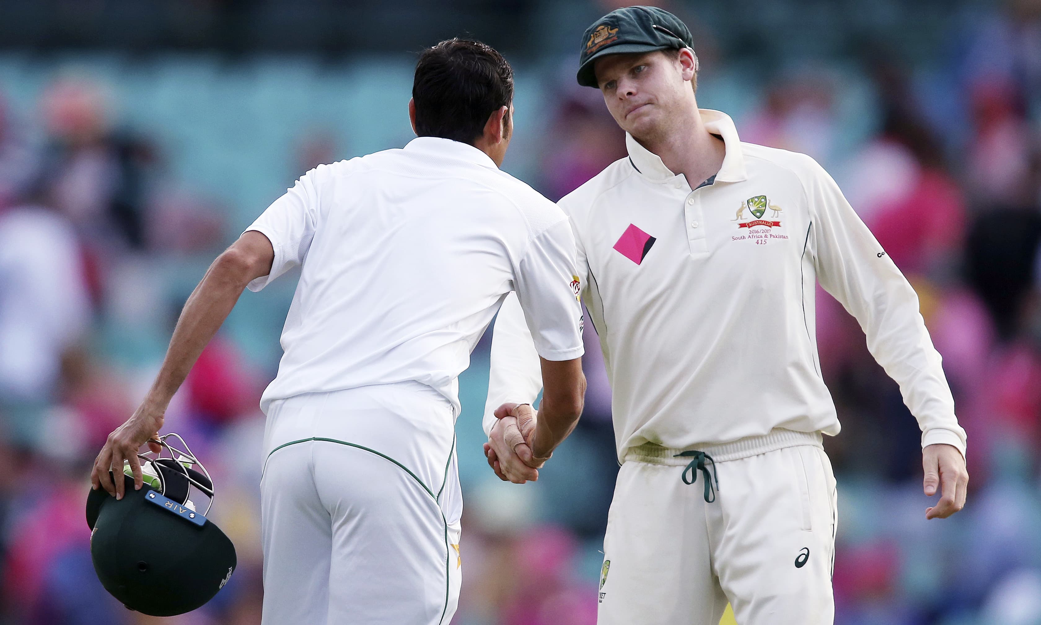 Steven Smith congratulates Younis Khan at the end of the day's play. —AP