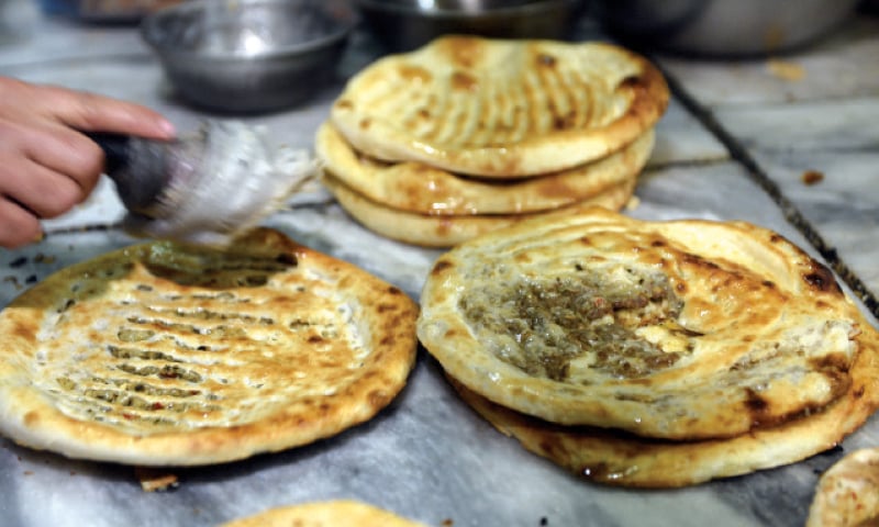 Various tandoors and restaurants are offering potato, chicken and mix vegetable filled naans. &mdash; Photos by Tanveer Shahzad
