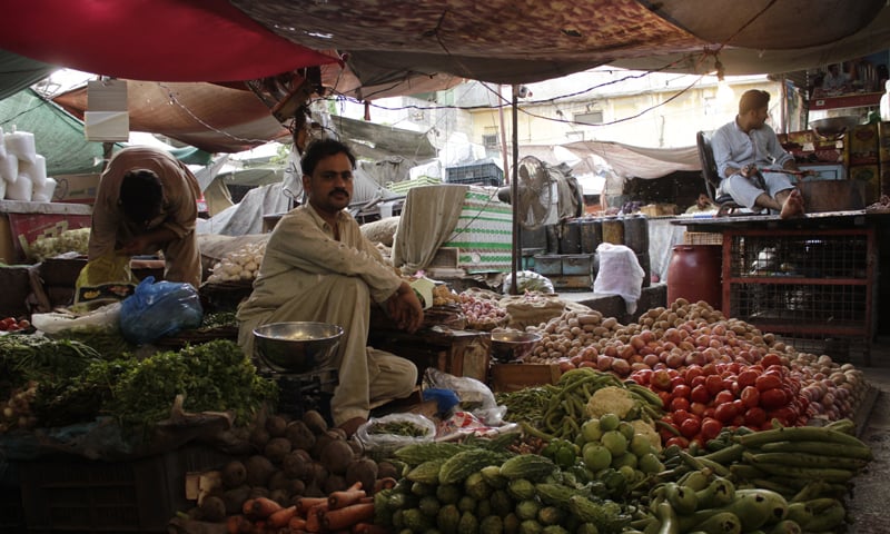A GREENgrocer waits for customers in Empress Market.&mdash;Photo by Shahab Nafees
