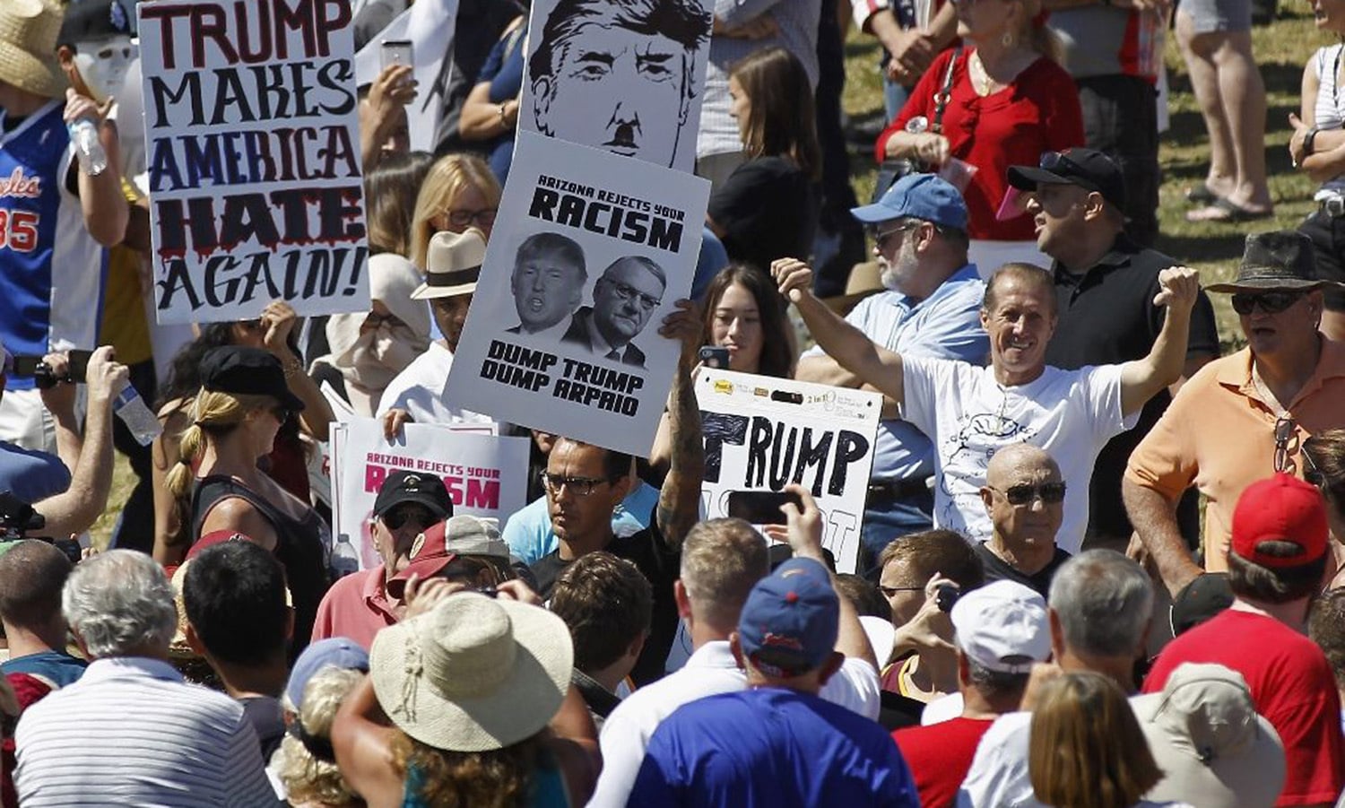 Protesters filter into a Trump campaign rally on Mar 19, 2016.—AFP