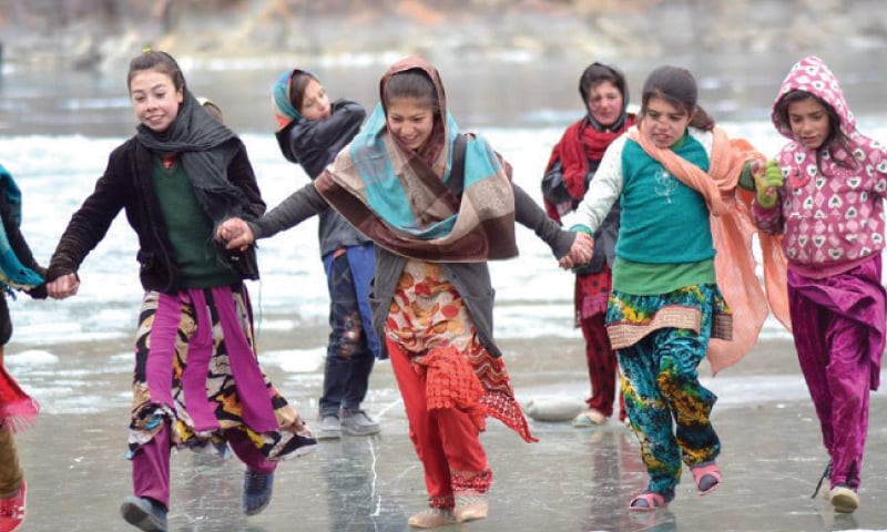Children play on the frozen Khalti lake in Ghizer district. &mdash; Photo by Jamil Nagri