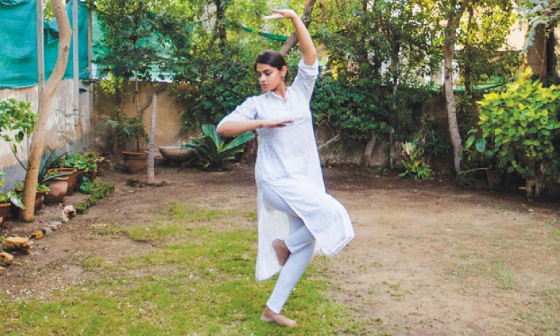 Leila who has been dancing for 12 years performs in a garden. -White Star