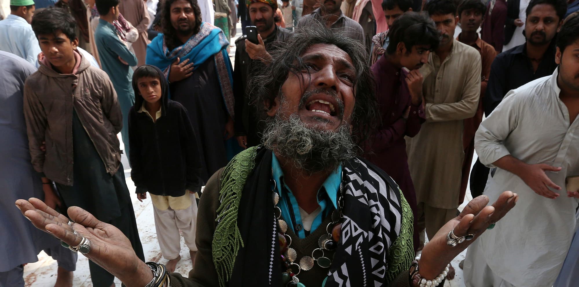 A man mourns the death of a relative who was killed in a suicide blast at the tomb of Sufi saint Syed Usman Marwandi, also known as the Lal Shahbaz Qalandar shrine, on Thursday evening in Sehwan Sharif, Pakistan's southern Sindh province, February 17, 2017. REUTERS/Akhtar Soomro     TPX IMAGES OF THE DAY