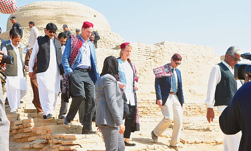 US diplomats Grace Shelton and Jonathan Pratt along with others visit Moenjodaro on Thursday.&mdash;Saeed Memon