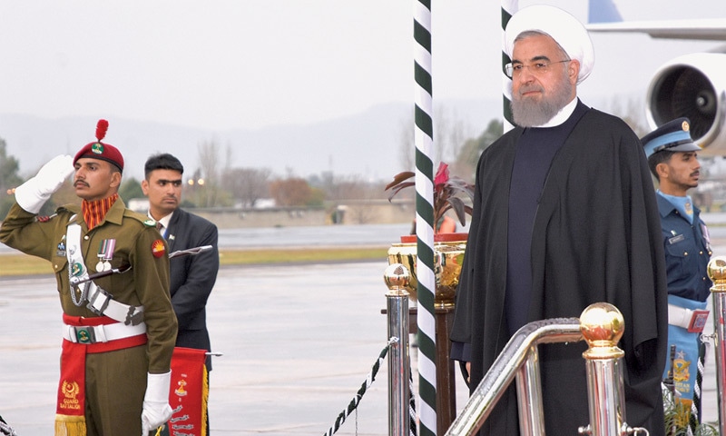 ISLAMABAD: Iranian President Hassan Rouhani on Tuesday receives a guard of honour at the Nur Khan Airbase after arriving here to participate in the 13th ECO summit.&mdash;APP
