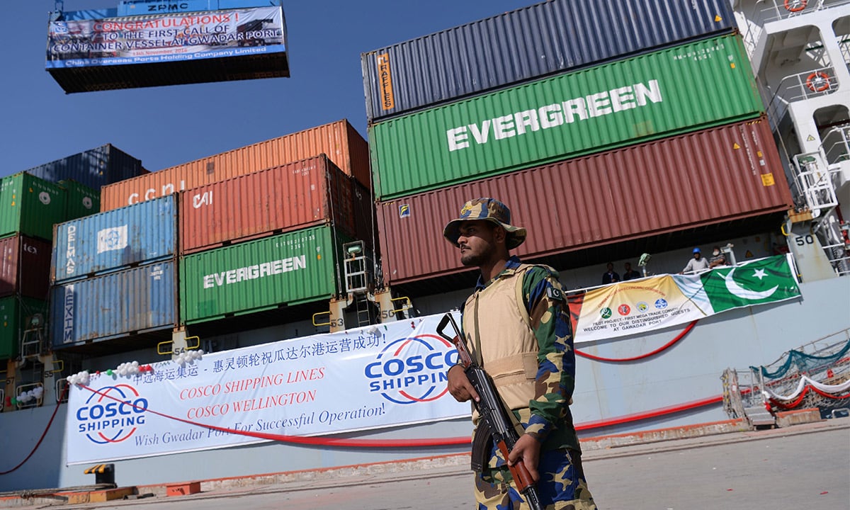 A navy official stands guard in front of the Cosco Wellington ship | AFP