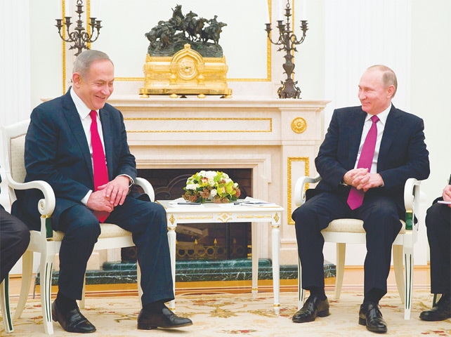 Moscow: Russian President Vladimir Putin (right) speaks to Israeli Prime Minister Benjamin Netanyahu during their meeting on Thursday.—AFP