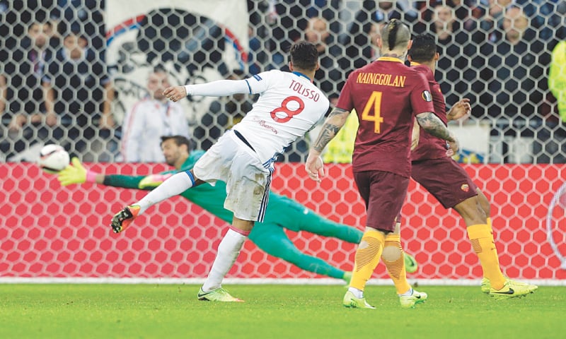 LYON: Olympique Lyon&rsquo;s Corentin Tolisso (second L) shoots to score during the Europa League last-16 first leg against AS Roma at the Parc Olympique Lyonnais.&mdash;AP