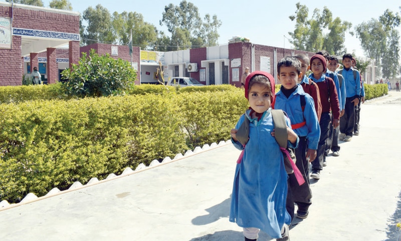 Students coming out from Govt Girls&rsquo; High School, Bhallar Jogi, where only eight classrooms cater to the need of over 700 students. &mdash; Dawn