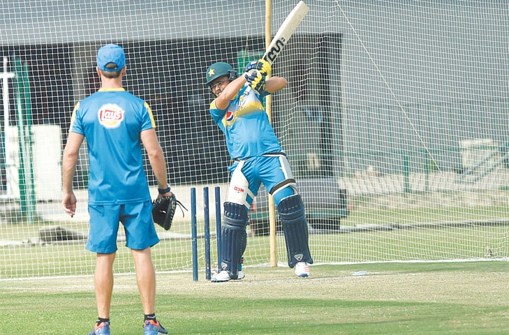 LAHORE: Kamran Akmal bats in the nets during the Pakistan team training camp at the Gaddafi Stadium on Tuesday.—M.Arif/White Star