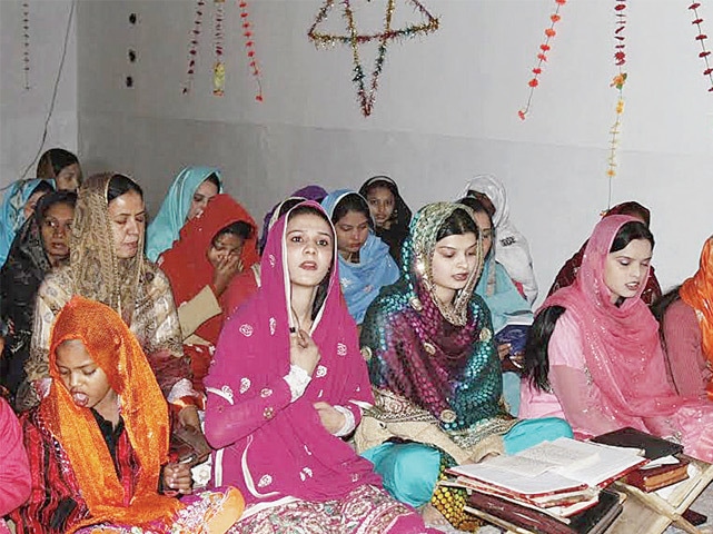 CHRISTIAN women pray at a makeshift church in Landi Kotal. &mdash; Dawn