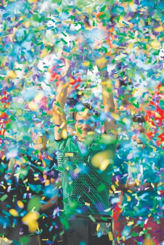 INDIAN WELLS: Roger Federer of Switzerland celebrates with the trophy after winning the BNP Paribas Open final against compatriot Stanislas Wawrinka.—AP