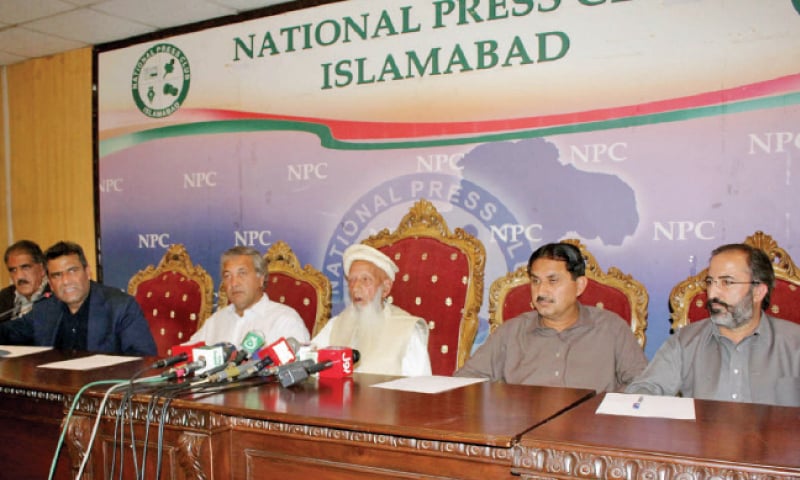 Baba Haider Zaman speaks at the press conference at the National Press Club on Monday. Former senator Hameedullah Jan Afridi and MNA Jamshed Dasti are also present. &mdash; Online