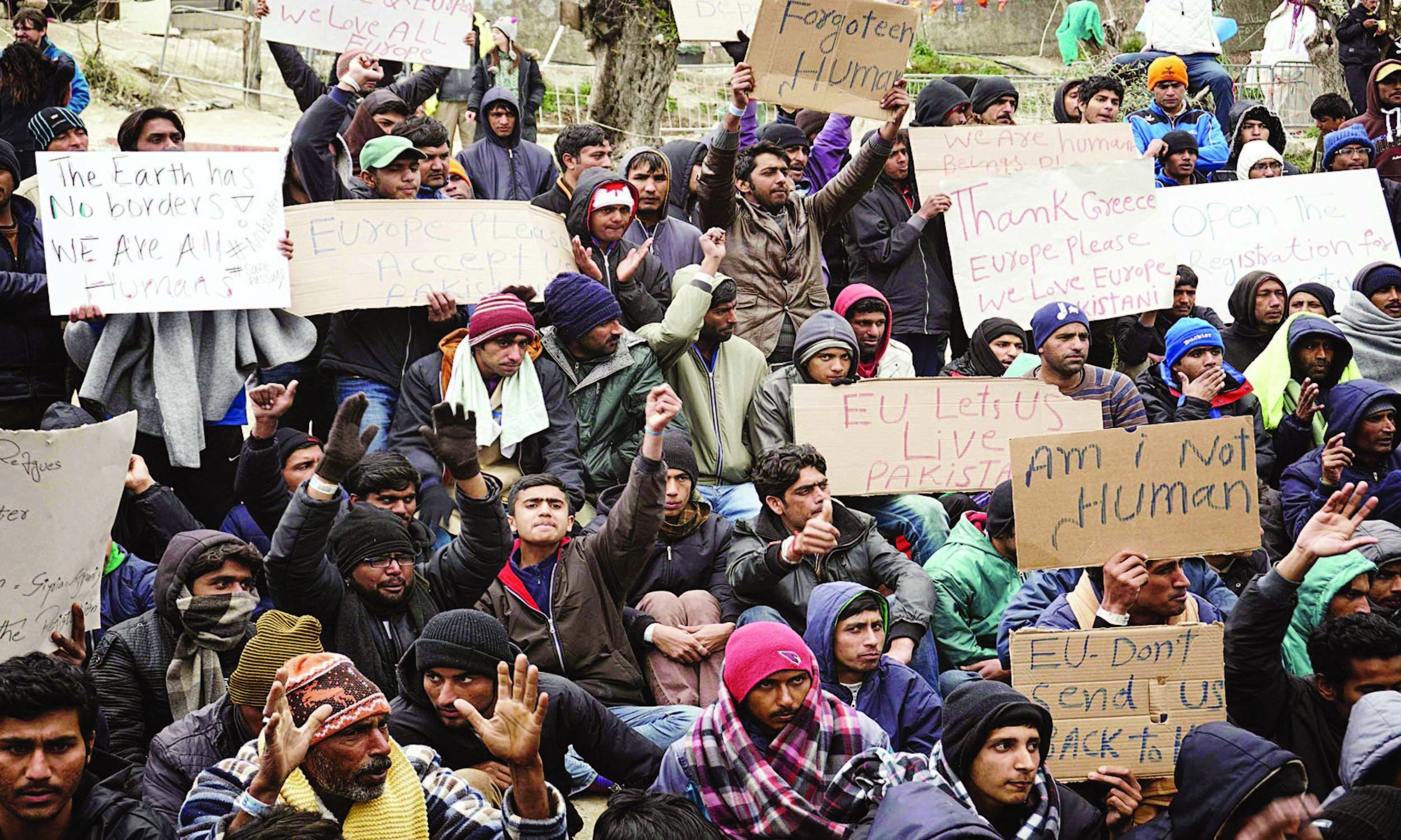 Pakistani migrants protest against deportation outside Moria detention centre at the Greek island of Lesbos in March 2016 | AFP