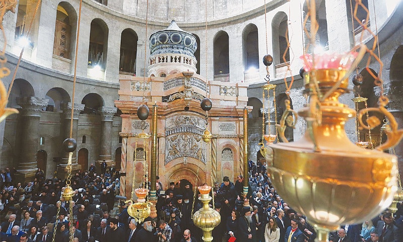 JERUSALEM: Visitors wait to enter the newly restored site of Jesus&rsquo; tomb following a ceremony marking the end of restoration work in the Church of the Holy Sepulchre on Wednesday.&mdash;Reuters