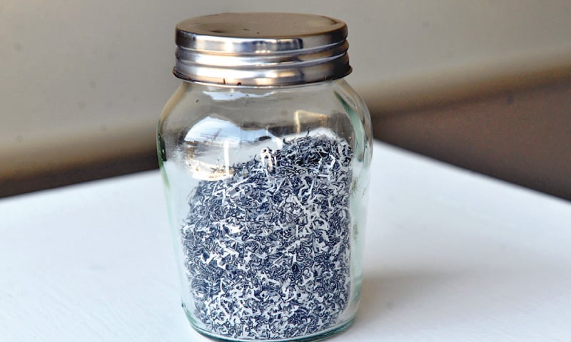 An untitled work (paper cutouts in glass bottle) / Photos by White Star