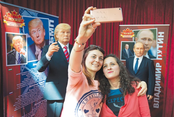 Sofia: Visitors Salzitsa Kotseva and Tanya Simeonova take a selfie in front of wax models of US President Donald Trump (left) and Russian President Vladimir Putin displayed in the wax museum on Friday. The wax figures of both leaders and other international personalities are part of a visiting exhibition from the Retro Museum from the Black Sea town of Varna, going on show to the public for the first time on Saturday.&mdash;AP