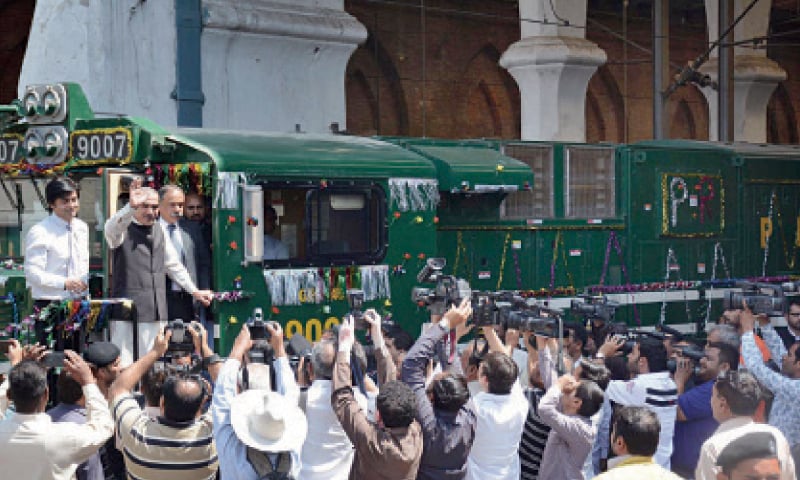 Minister for Railways Khawaja Saad Rafique waves to media persons at the inauguration ceremony.&mdash;Online